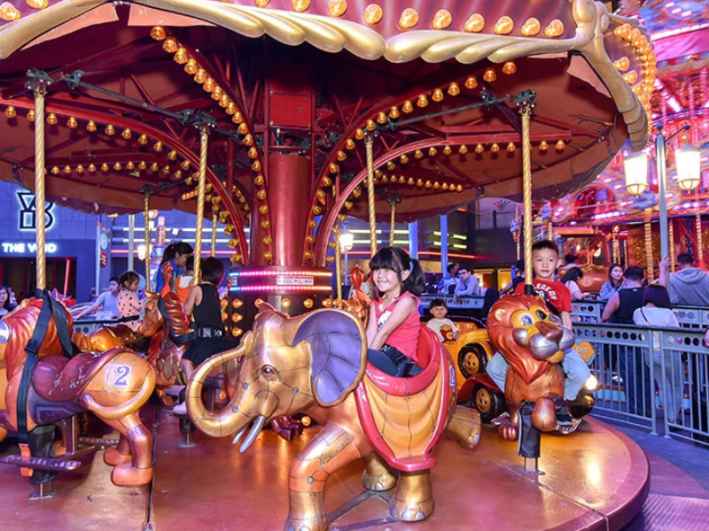 Various colorful family and thrill rides inside Skytropolis Indoor Theme Park, an action-packed destination perfectly suited for your flexible Genting Highlands day trip private car schedule.