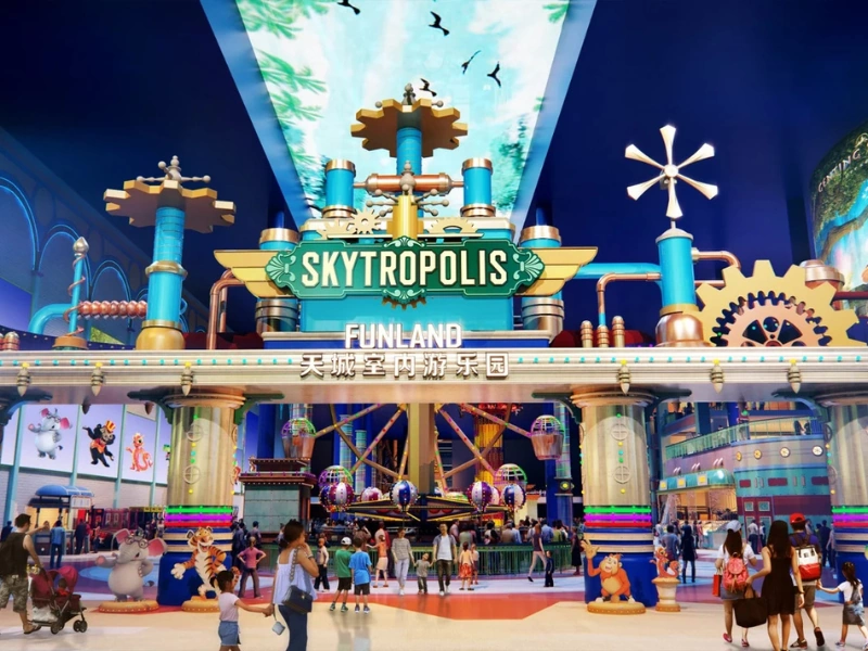 Vibrant neon lights and thrilling rides at Skytropolis Indoor Theme Park, an all-weather entertainment hub safely accessible rain or shine with your Genting Highlands day trip private car.