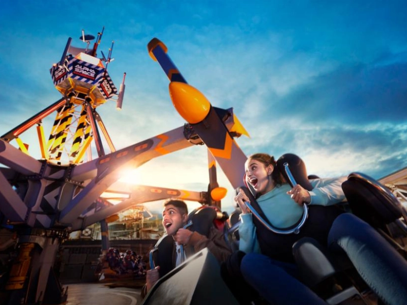 Thrill-seekers enjoying the sci-fi Alpha Fighter Pilots ride at Genting SkyWorlds Theme Park, an action-packed adventure made comfortable rain or shine with your Genting Highlands day trip private car.