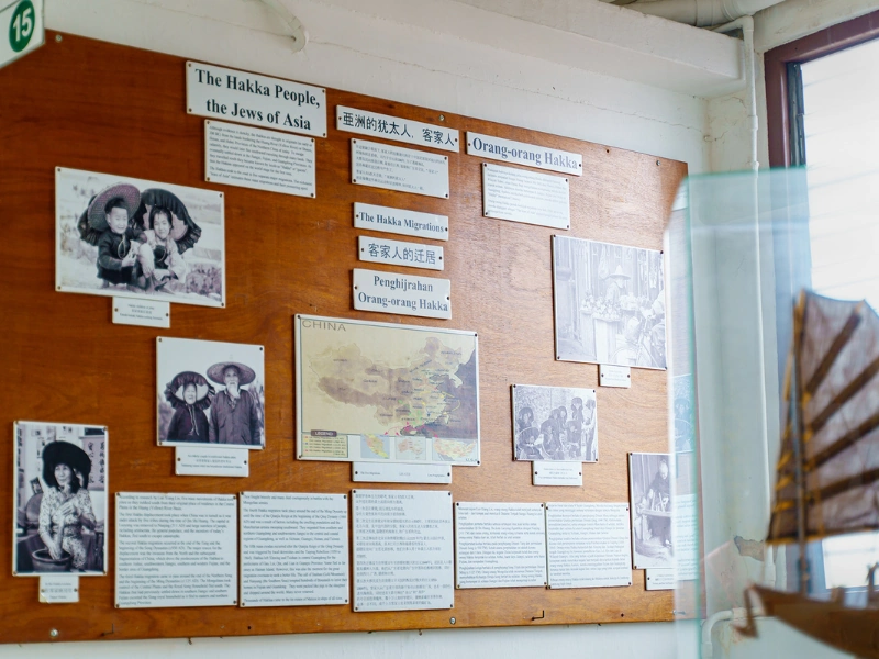 The detailed exhibition on Hakka migration history at Han Chin Pet Soo, a rich cultural experience you can explore with full energy using our relaxing private transfer on your Ipoh day trip.