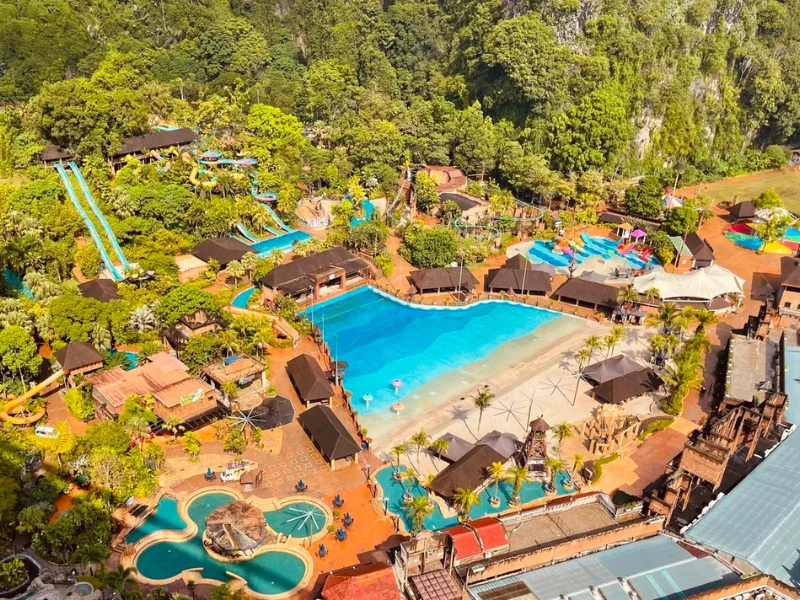 The expansive aerial view of Sunway Lost World of Tambun, a premier family resort you can enjoy to the fullest with our relaxing private transfer on your Ipoh day trip.