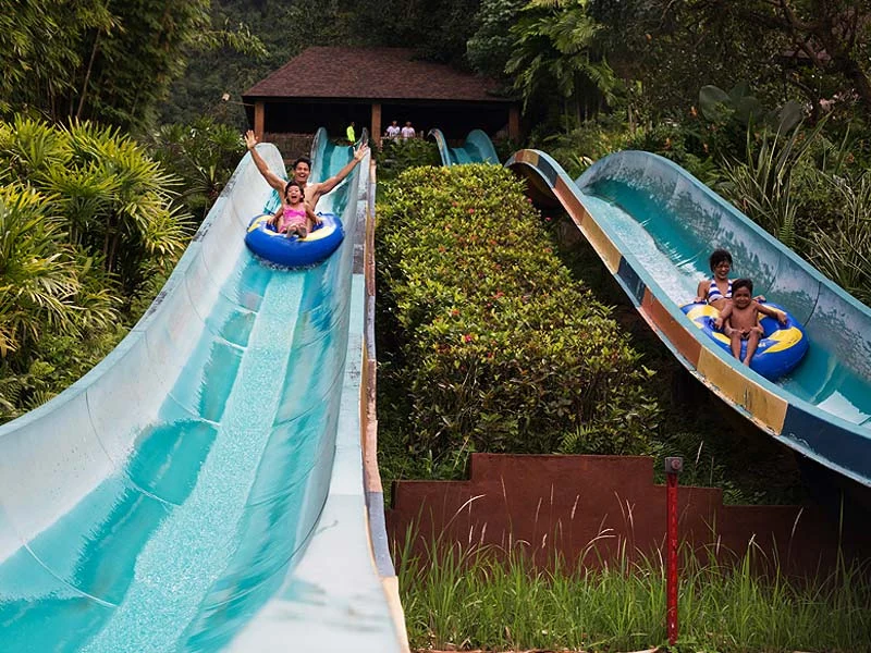 Thrilling water slides at the Lost World of Tambun, an exciting family adventure you can fully enjoy before resting safely in our private car on your Ipoh day trip.