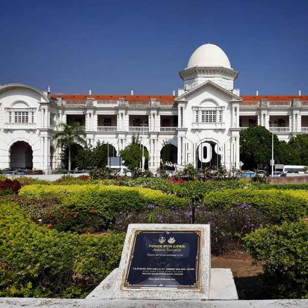 The iconic IPOH sign in front of the historic Ipoh Railway Station, a majestic colonial landmark you can easily photograph with convenient drop-offs on your Ipoh day trip.