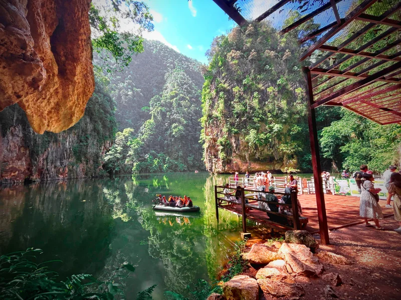 The breathtaking reflection of limestone hills at Tasik Cermin (Mirror Lake), a stunning natural spot you can explore at your own pace during your Ipoh day trip.