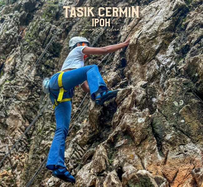 Exciting rock climbing on the limestone cliffs of Tasik Cermin, a thrilling challenge you can tackle before resting in our comfy car on your Ipoh day trip.