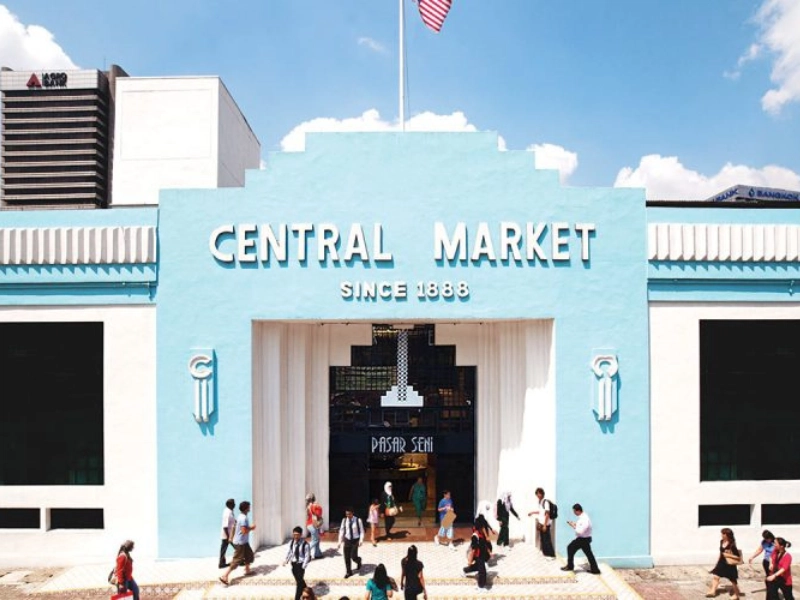 Front view of the historic blue Central Market building since 1888, a heritage highlight to explore during your Kuala Lumpur day trip private car tour.