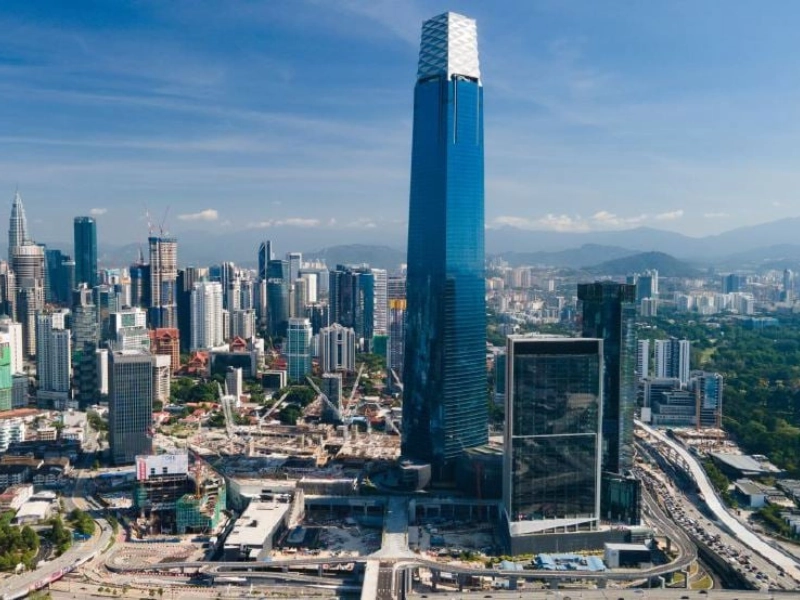 The towering Exchange 106 building dominating the Tun Razak Exchange (TRX) skyline, a premier shopping hub easily visited during your Kuala Lumpur day trip private car tour.