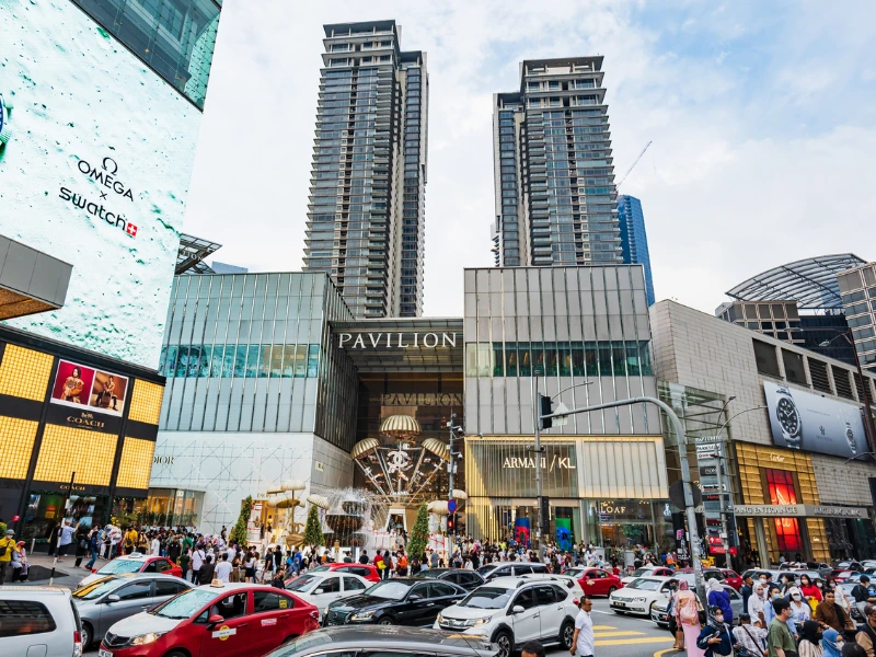 The bustling entrance of Pavilion KL in Bukit Bintang, a premier shopping hub you can enjoy without traffic and parking stress on your Kuala Lumpur day trip private car tour.