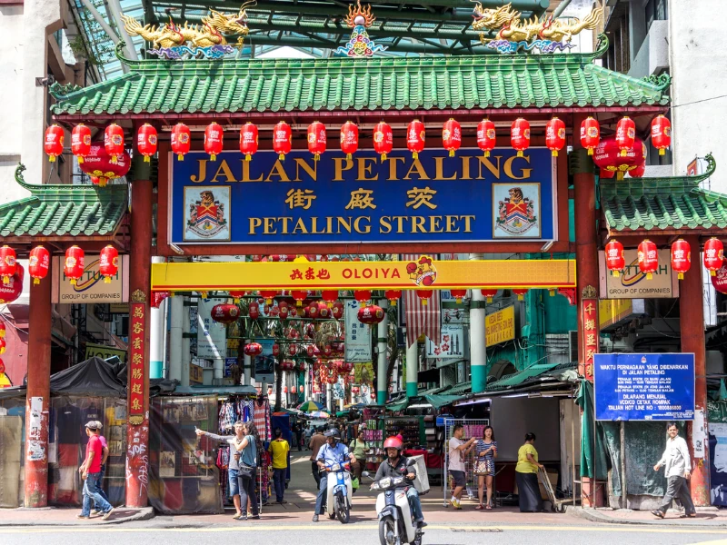 The iconic green-roofed entrance gate of Petaling Street (Chinatown), a must-visit food and heritage stop on your Kuala Lumpur day trip private car itinerary.