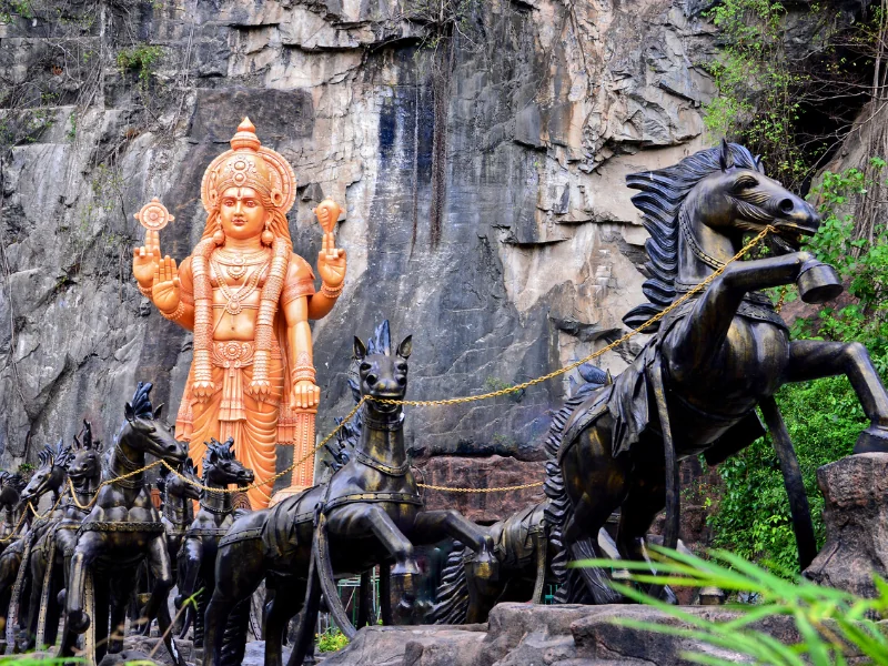 The stunning Lord Vishnu and horse chariot statue at Ramayana Cave, a captivating cultural stop to explore during your Kuala Lumpur day trip private car tour.