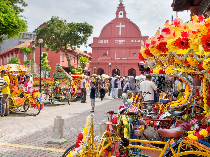 Historic red Christ Church at Dutch Square, a must-visit UNESCO heritage site during your custom Malacca day trip private car tour.