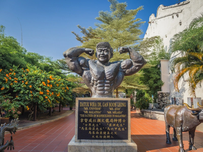 Statue of Datuk Wira Dr. Gan Boon Leong at Jonker Street, a unique cultural landmark to visit during your Malacca day trip private car tour.