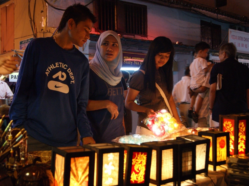 Stunning night view of the bustling Jonker Walk, a perfect evening highlight to conclude your Malacca day trip private car tour.