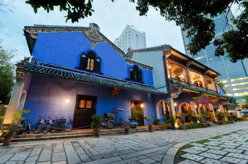 The iconic indigo Cheong Fatt Tze Blue Mansion in Georgetown, a stunning heritage site you can arrive at perfectly on time without parking stress on your Penang Day Trip private car.