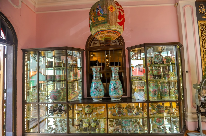 Exquisite Nyonya porcelain and antiques inside Pinang Peranakan Mansion, a fascinating cultural gem you can admire leisurely without travel fatigue on your Penang Day Trip private car.