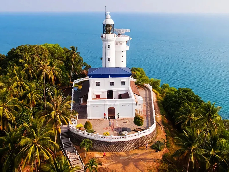 The historic 16th-century Cape Rachado Lighthouse, a beautiful nature and heritage stop easily accessed during your Port Dickson day trip private car tour.