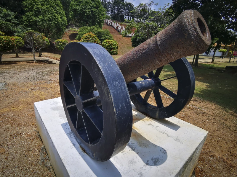 Historic 19th-century cannon at Kota Lukut fort, a fascinating colonial heritage site to visit during your Port Dickson day trip private car tour.