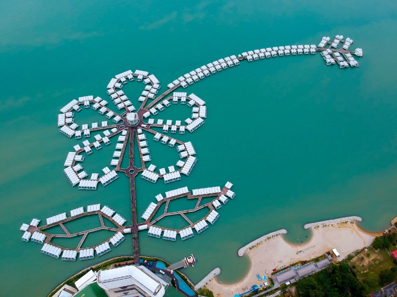 Aerial view of the iconic Lexis Hibiscus water villas, a luxurious drop-off or sightseeing point during your Port Dickson day trip private car tour.