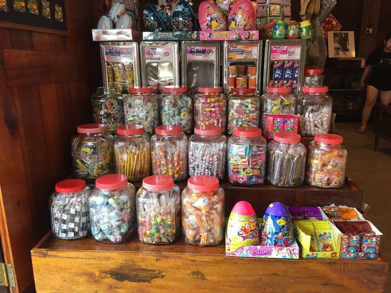 Nostalgic childhood candies and vintage snacks hanging at Ah Ma House, a must-visit cultural stop easily included in your customized Sekinchan day trip private car itinerary.