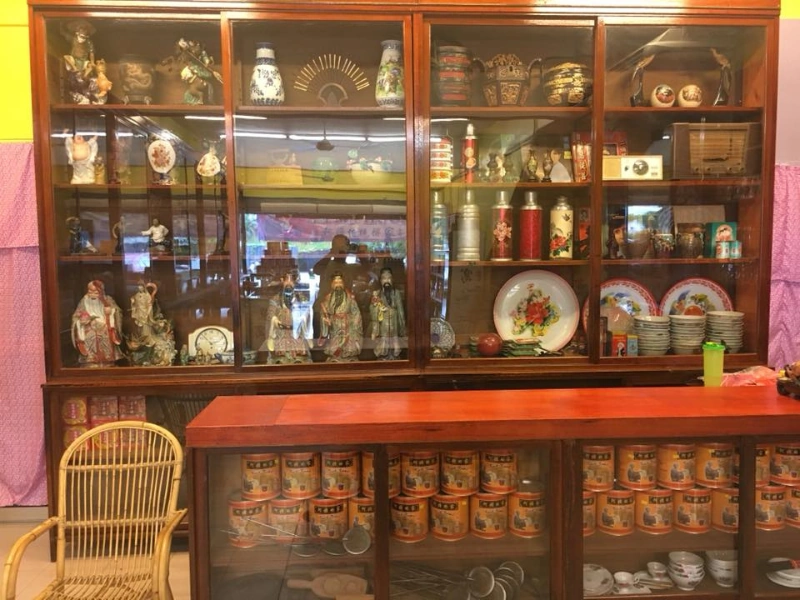 The nostalgic vintage interior of Ah Ma House filled with classic antiques, a memorable stop for elderly family members traveling comfortably in your Sekinchan day trip private car.