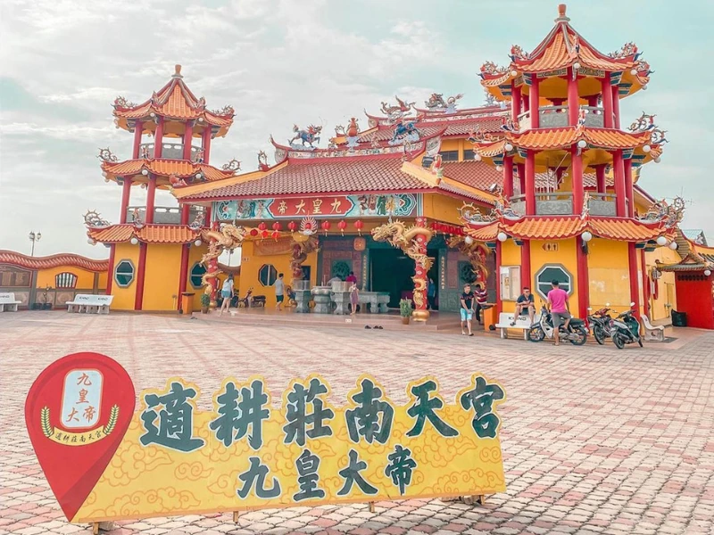 The vibrant Nan Tian Temple surrounded by lush paddy fields, a peaceful cultural stop perfectly suited for your flexible Sekinchan day trip private car itinerary.
