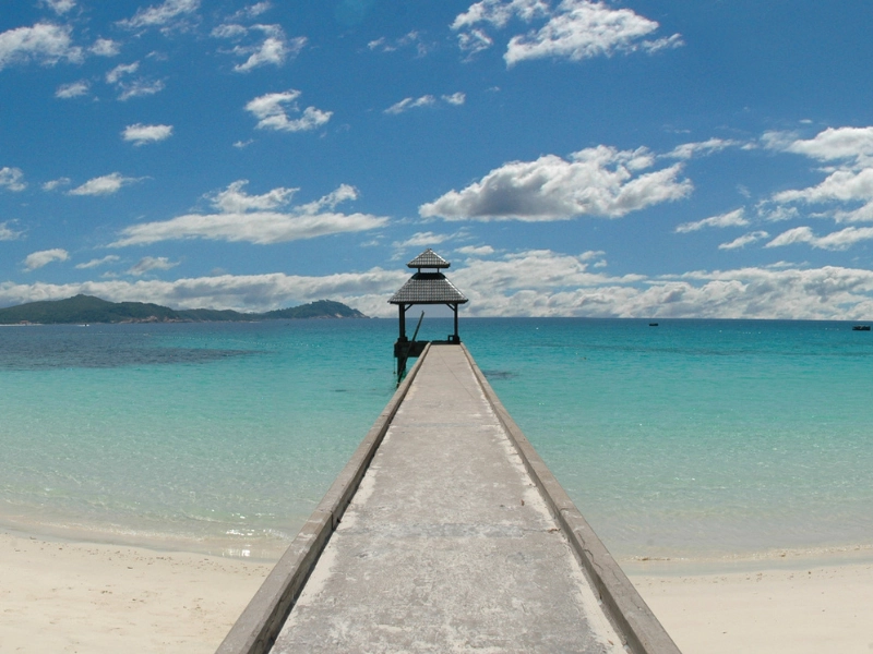 Beautiful beach resort at Tioman Island, the perfect tropical getaway seamlessly connected by our Singapore to Mersing day trip transfer.
